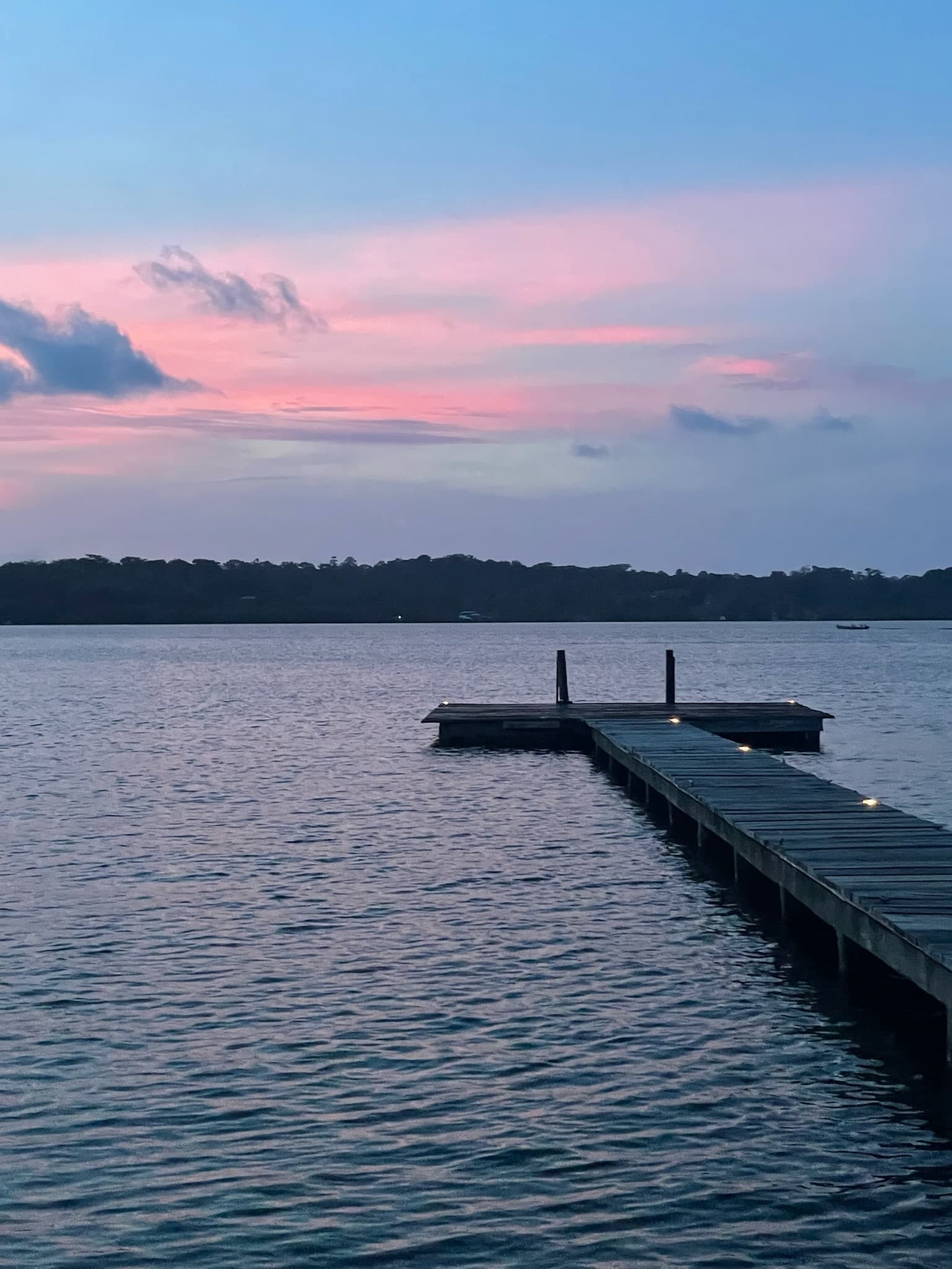 Wooden pier at twilight on Dolphin Bay