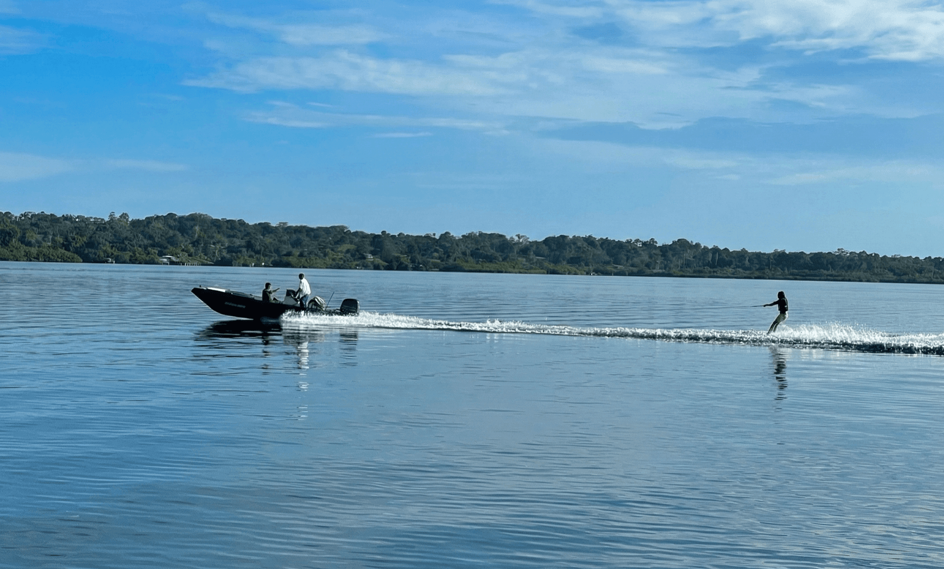 Boat crossing the calm waters of Dolphin Bay in Bocas del Toro