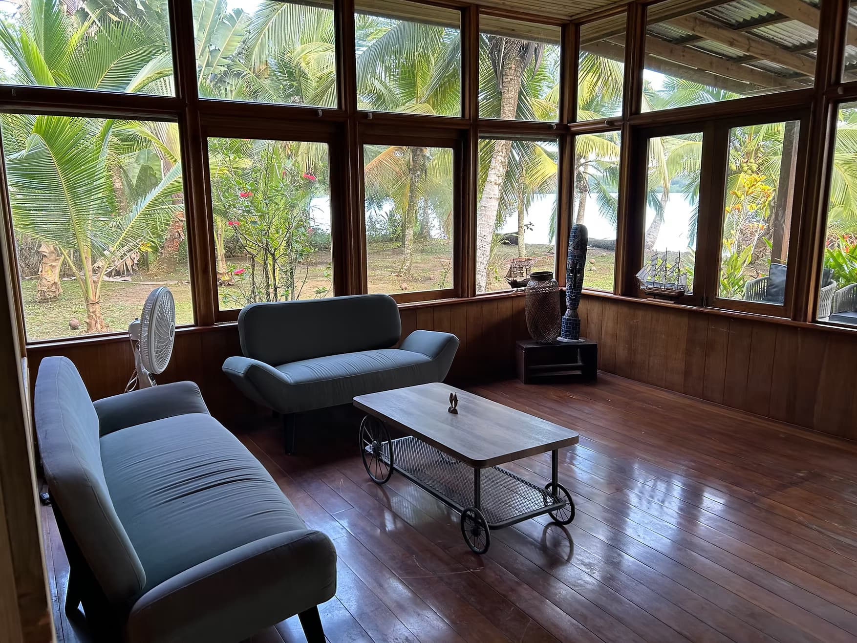 Salon Azul interior relaxation space at Dolphin Blue Paradise, Bocas del Toro - serene space for reading, meditation, and board games